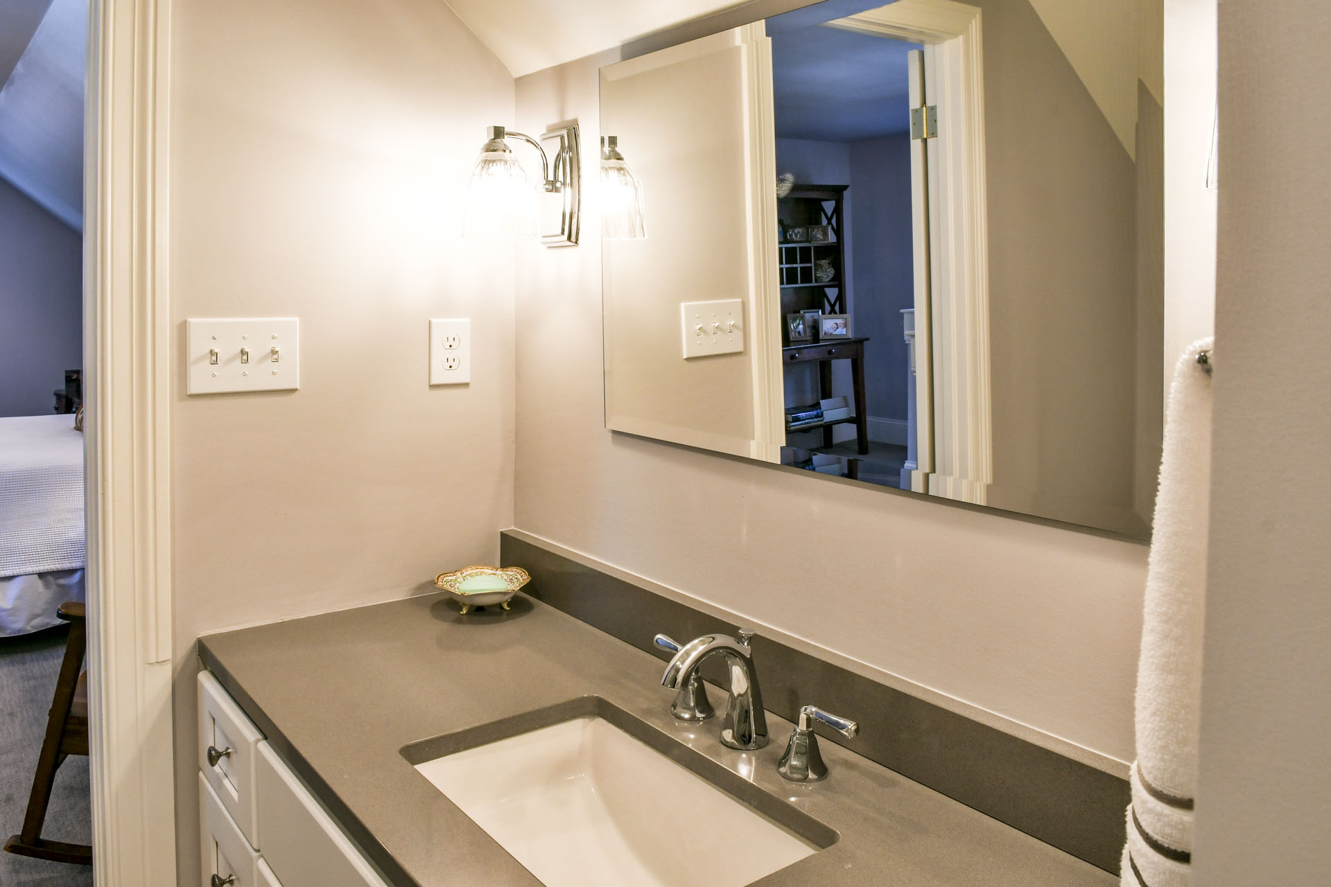 Louisville Kentucky Home Renovation, Louisville Kentucky Attic Renovation, Castlerock, Guest Suite, En Suite Bath, Sweet Retreat, Bedroom, Bathroom Addition, En Suite Bathroom, Sitting Area, Gray Wall Color, Antique Furniture, Built In Shelving, Gray Subway Tile, Chrome Finishes, White Built In Shelving, Granite Vanity Top, White Vanity, Vanity Lighting, Glassed In Shower, Hinged Door Shower, Large Shower, Marble Tile Flooring, Stairway, Before and After