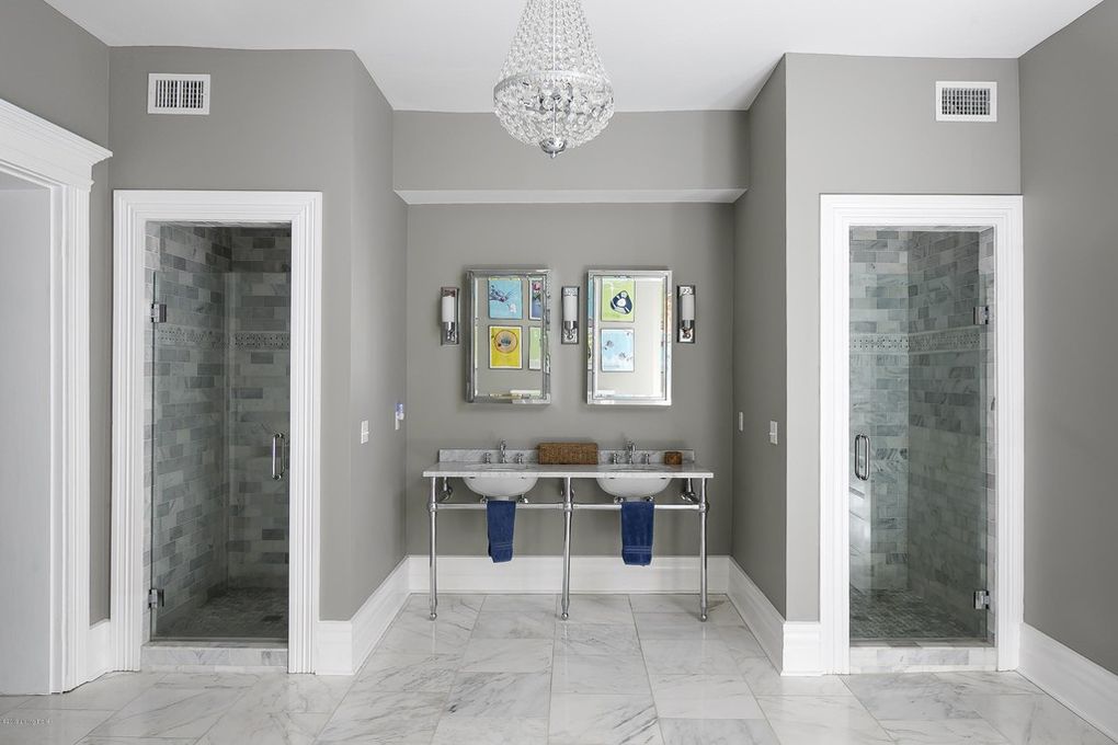 Dual bathroom sinks, vanity lighting, vanity mirrors, Louisville Interior Design, Louisville Home Staging, dual showers, artwork, crystal bathroom chandelier