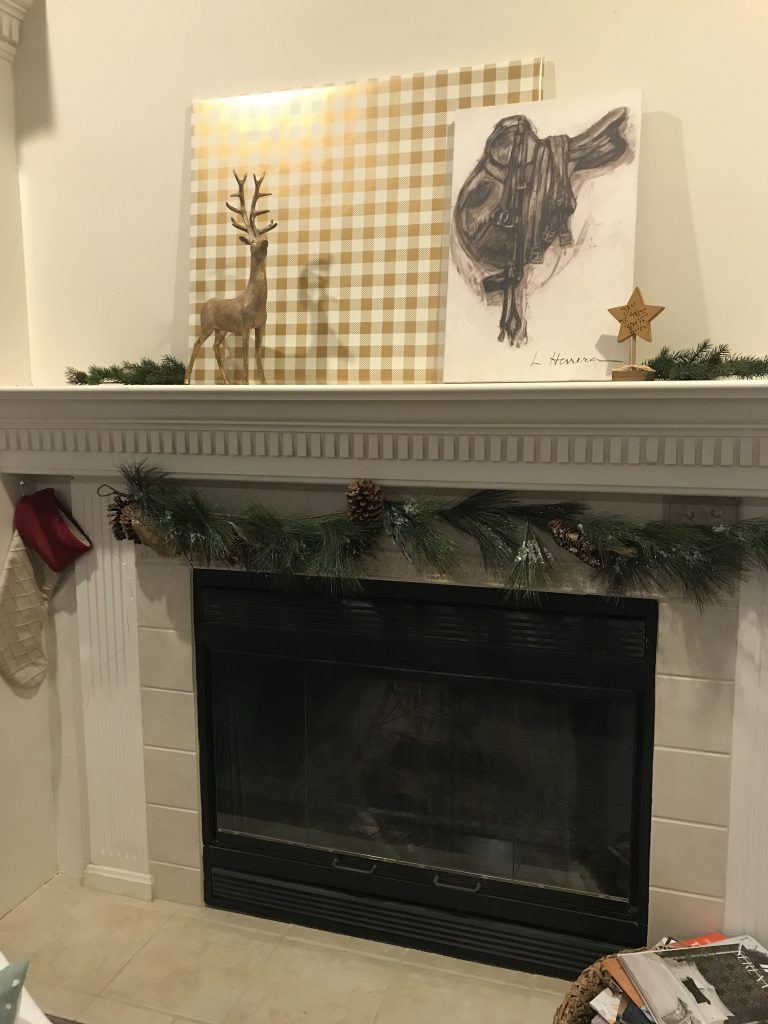 Louisville holiday decor, gold reindeer, stockings, fireplace, garland, star

