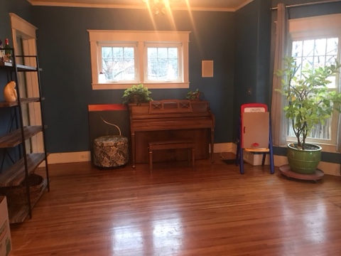 empty family room, hardwood floors, windows, blue wall paint